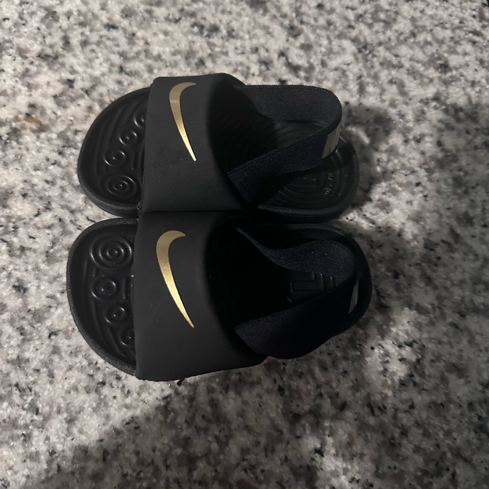 Nike Kids Black Sandals with Gold Swoosh